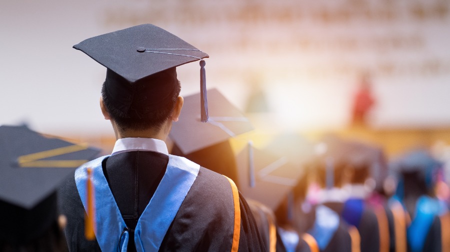 student in graduation cap and gown