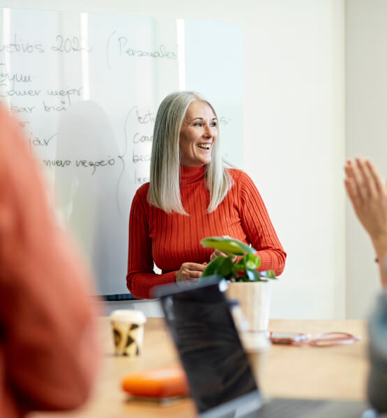 Woman smiling while giving a presentation