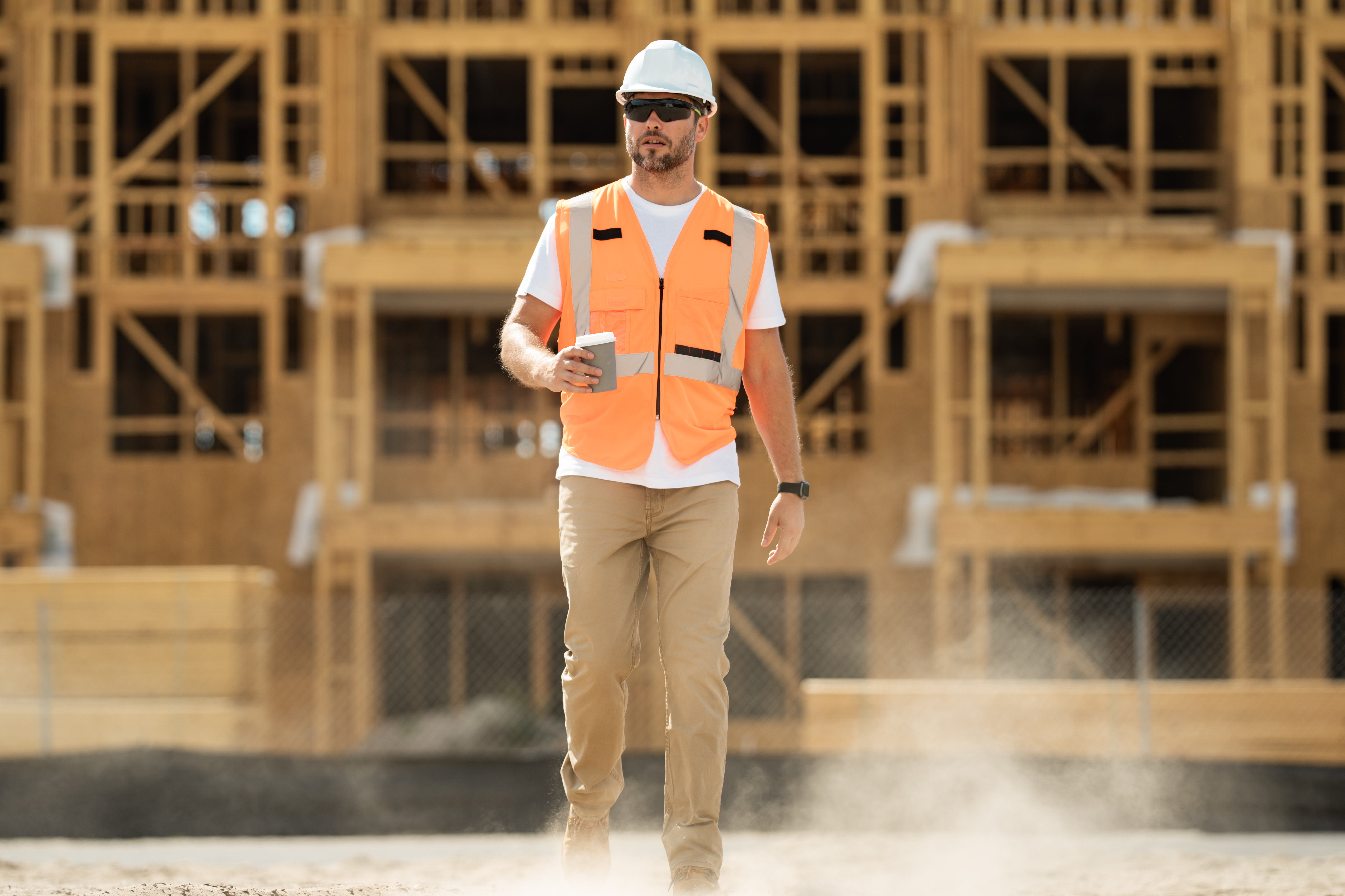 man in vest on construction site